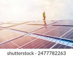 Professional Engineer Service Solar Panel. Worker Maintenance Cleaning Replacing Solar Panel. Solar photovoltaic panel system in Industry roof. Saving Energy with Clean Power.
