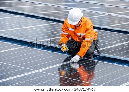 Professional Engineer Service Solar Panel. Worker Maintenance Cleaning Replacing Solar Panel. Solar photovoltaic panel system in Industry roof. Saving Energy with Clean Power.
