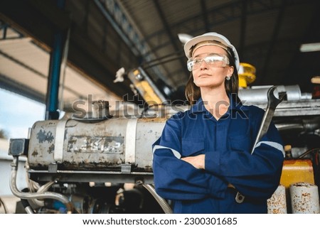 Professional engineer women worker or mechanical foreman working to maintenance and check in factory warehouse, engineering women training workshop for factory operators, Business factory industry.
