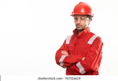 Professional Engineer Worker In A Helmet And Red Protective Workwear Uniform Holding His Hands Crossed Isolated On White Background With Copy Space. Close-up Portrait