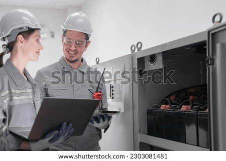 Professional engineer workers training and testing machine at industry factory. Concept people operation in industrial. Industry robot programming software for automated manufacturing technology.