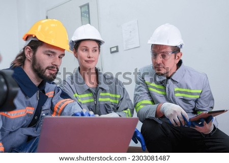 Professional engineer workers training and testing machine at industry factory. Concept people operation in industrial. Industry robot programming software for automated manufacturing technology.