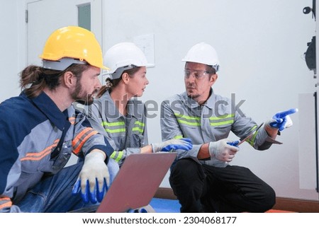 Professional engineer workers training and testing machine at industry factory. Concept people operation in industrial. Industry robot programming software for automated manufacturing technology.
