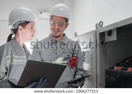 Professional engineer workers training and testing machine at industry factory. Concept people operation in industrial. Industry robot programming software for automated manufacturing technology.