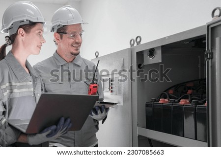 Professional engineer workers training and testing machine at industry factory. Concept people operation in industrial. Industry robot programming software for automated manufacturing technology.