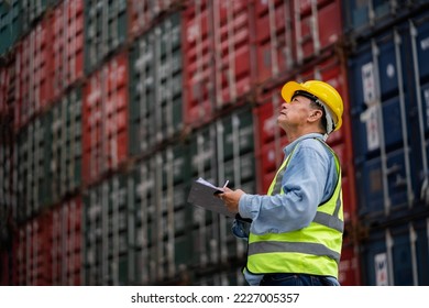 Professional engineer working in container warehouse Container Yard Warehouse Inspection. Import and export cargo industry. Logistics transportation concept. business Logistics oversea import export