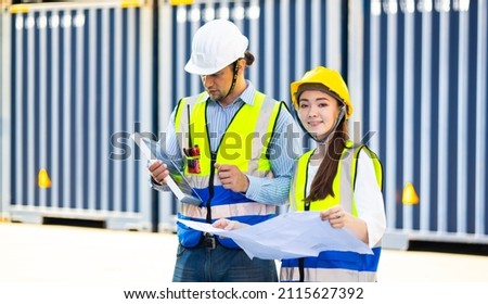 Professional engineering caucasian man and woman technician maintenance service and support of solar panels meeting in container yard. Solar energy, a clean and green alternative energy concept.