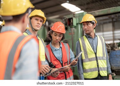 Professional Engineering Workers Walk And Check In Warehouse Factory. Manager Discuss Inspection Report For Internal Audit. Quality Assurance For Manufacturing. Concept Engineer Operating.