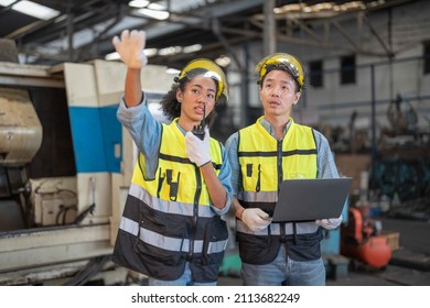 Professional Engineering Workers Walk And Check In Warehouse Factory. Manager Discuss Inspection Report Paper For Internal Audit. Quality Assurance For Manufacturing. Concept Engineer Operating.