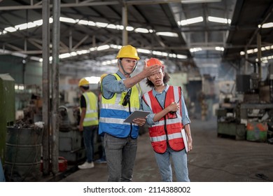 Professional Engineering Workers Walk And Check In Warehouse Factory. Manager Discuss Inspection Report For Internal Audit. Quality Assurance For Manufacturing. Concept Engineer Operating.