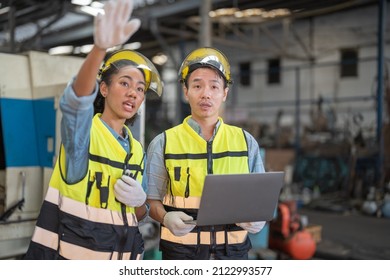 Professional Engineering Workers Walk And Check In Warehouse Factory. Manager Discuss Inspection Report Paper For Internal Audit. Quality Assurance For Manufacturing. Concept Engineer Operating.