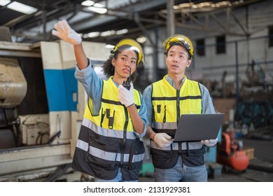 Professional Engineering Workers Walk And Check In Warehouse Factory. Manager Discuss Inspection Report Paper For Internal Audit. Quality Assurance For Manufacturing. Concept Engineer Operating.