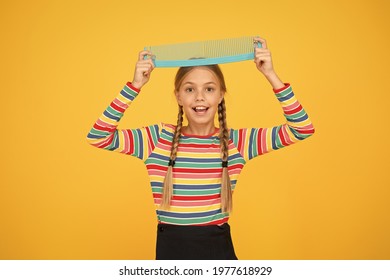 Professional Equipment. Comb For Tangled Hair. Hairdresser Supplies. Large Comb. Girl Long Hair Hold Enormous Comb. Hairdresser Salon. Combing Hair. Cheerful Happy Smiling Little Kid With Giant Comb