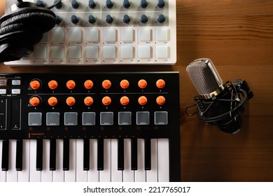 Professional Equipment For Recording Studio, Music Studio. Studio Microphone, Studio Headphones On Midi Keyboard. Close-up. There Are No People In The Photo. Advertising, Banner.