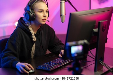 Professional E-sport Gamer Girl Streaming And Plays Online Video Game On PC