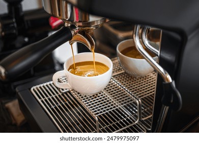 Professional espresso machine while preparing  espressos coffee cup in a coffee shop. Close-up of espresso pouring from the coffee machine - Powered by Shutterstock