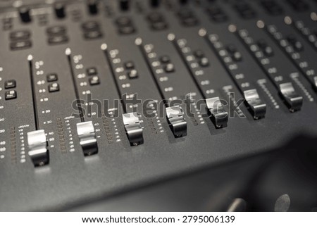 professional fader knobs of audio music production studio mixing equipment