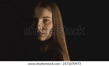 Similar – Image, Stock Photo Dramatic portrait of Black adult man looking up into spotlight while standing on stage in theater with low light copy space