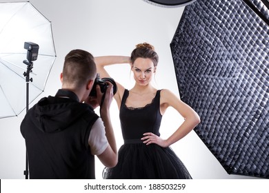 Professional fashion photography in studio with softboxes