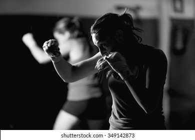 Professional Female Boxer Practicing Strokes. Black And White