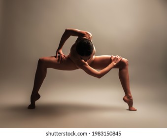 Professional female contemporary dancer isolated in studio