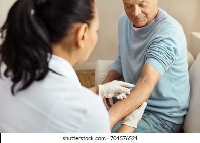 Professional Female Doctor Doing An Intravenous Injection