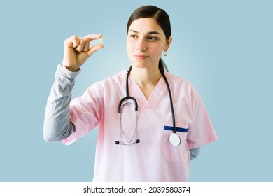 Professional Female Doctor Holding A Medicine Pill And Trying A New Medical Treatment 