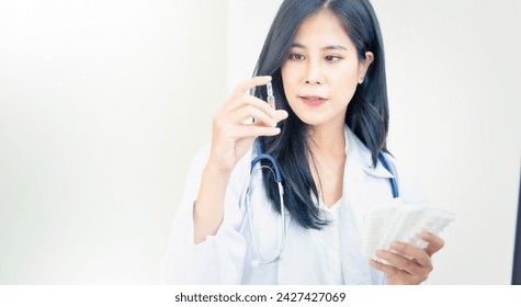 Professional female doctor prepare medicine at hospital. - Powered by Shutterstock