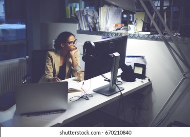 Professional Female Editor Sitting In Studio While Choosing Video For Prime Time Watching Media Materials On Modern Computer Connected To Free Wireless Internet In Newsroom During Working Day 