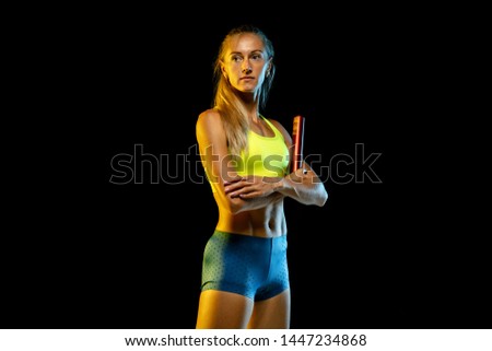 Similar – Close up front upper body portrait of one middle age athletic woman in sportswear in gym over dark background, looking at camera and smiling