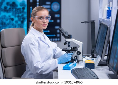 Professional Female Scientist Is Working On A Vaccine In A Scientific Research Laboratory. Genetic Engineer Workplace. Technology And Science Concept.