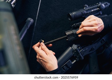 Professional Female Sniper Hands Assembling A Gun