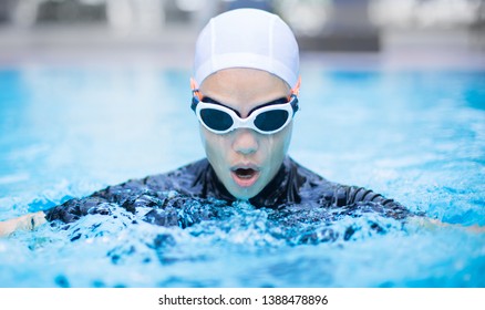 Professional Female Swimmer Lap Training In The Pool.