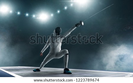 Professional fencer in fencing mask with rapier