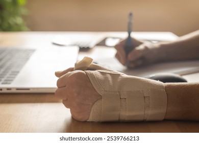 Professional Filling Out Workplace Injury Form Due To Wrist Pain From Repetitive Office Work, Illustrating Risks Of Carpal Tunnel And Tendonitis From Strain. Sick Leave - Powered by Shutterstock