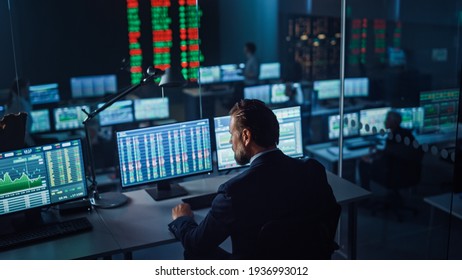 Professional Financial Data Analysts Working in Modern Monitoring Office and Live Analytics Feed Big Digital Screen  Monitoring Room and Finance Specialists Sit in Front Computers 