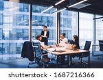Professional financial experts collaborating during brainstorming meeting listening information from clever female director, businesswoman providing information to corporate workers of company