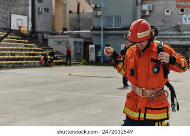 Professional Firefighter Suits Up in Full Gear for Duty - Powered by Shutterstock