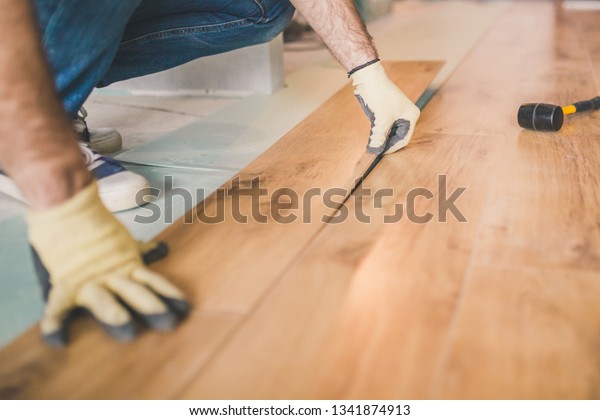 Professional Flooring Installation Laying New Laminate Stock