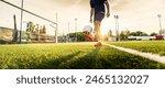 Professional football kicking ball in soccer stadium - Athletic man training sport outside - Concept about sports, competition, motion, overcoming.