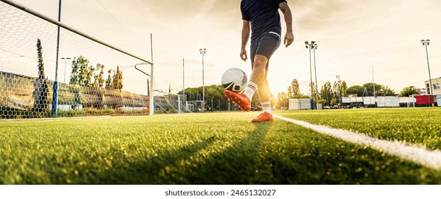 Professional football kicking ball in soccer stadium - Athletic man training sport outside - Concept about sports, competition, motion, overcoming. - Powered by Shutterstock