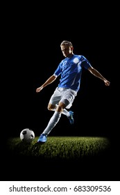 Professional Football Soccer Player In Action Isolated On Black