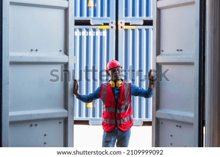Professional foreman work at Container cargo site check up goods in container. Workers are opening containers for inspection and check.