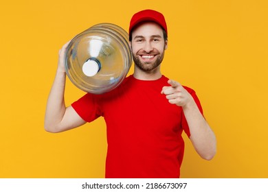 Professional Fun Delivery Guy Employee Man In Red Cap T-shirt Uniform Workwear Work As Dealer Courier Hold Water Bottle Point Finger Camera On You Isolated On Plain Yellow Background Studio Portrait.