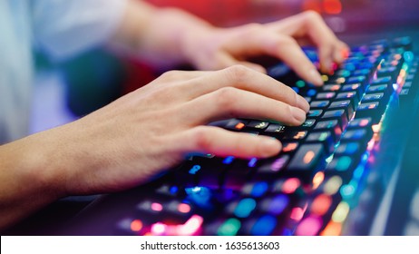 Professional gamer playing tournaments online video games computer with headphones, red and blue. - Shutterstock ID 1635613603