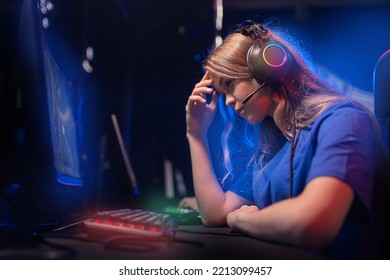 Professional Gamer Of Team Computer Players, Young Woman Loser Is Defeated In Online Video Games, Neon Color, Soft Focus.