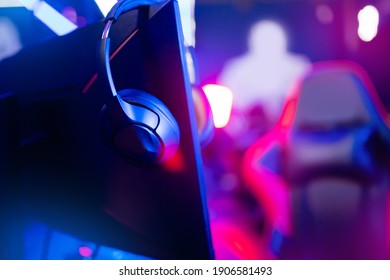 Professional Gamers Room With Headphones Microphone For Cyber Esports And Video Games On Neon Background Of Gaming Monitor.