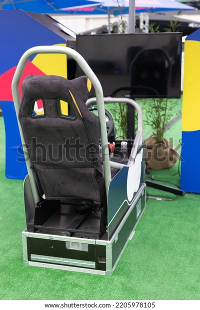 Professional Gaming Seat with\
Steering Wheel, Pedals and Screen for driving Simulator Video\
Game.