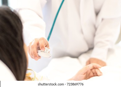 Professional General Medical Paediatrician Doctor In White Uniform Listen Lung And Heart Sound Of Asia Child Patient With Stethoscope: Physician Check Up Asian Kid Female Admission In Hospital