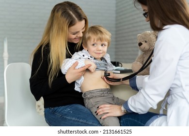 Professional General Medical Pediatrician Doctor In White Uniform Gown Listen Lung And Heart Sound Of Child Patient With Stethoscope: Physician Check Up Kid Female After Consult In Hospital